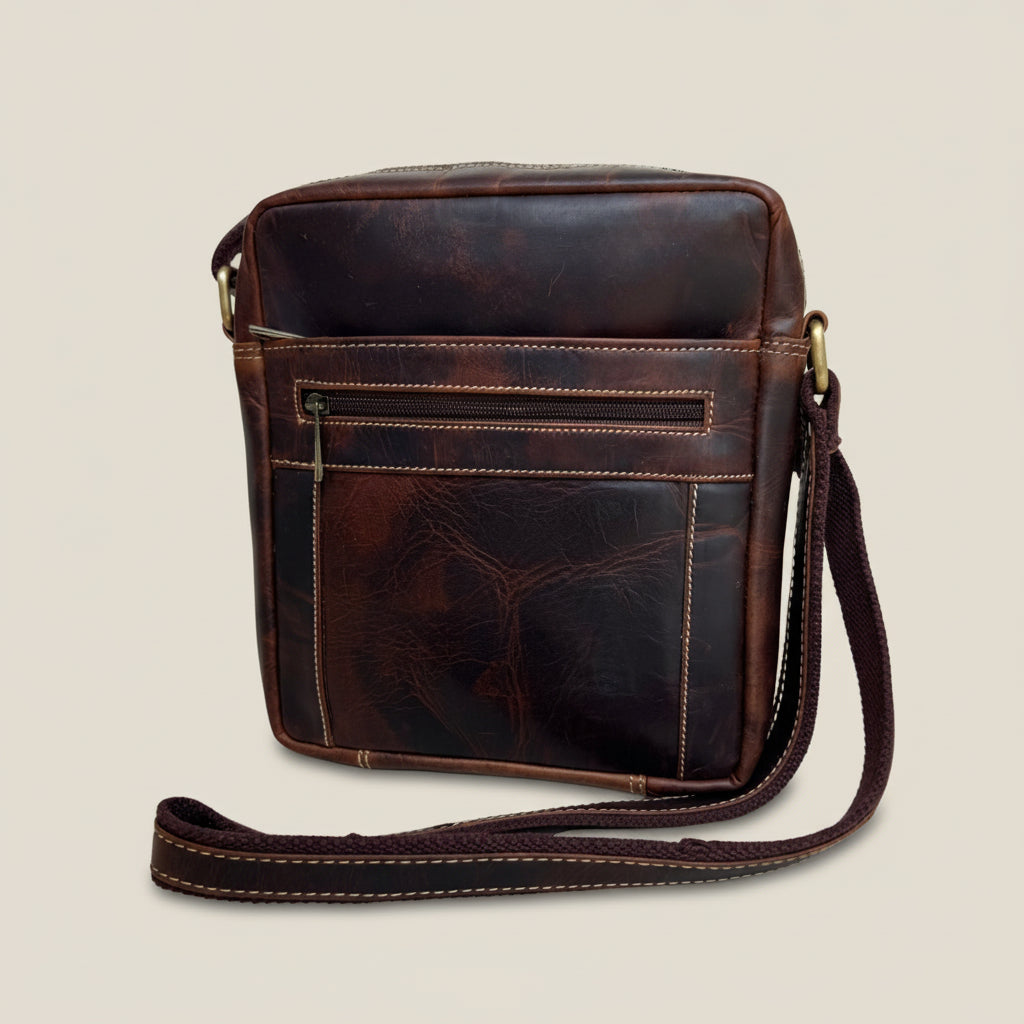 Brown leather crossbody bag on a white background
